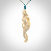 This pendant is a gorgeous and intricately carved mermaid and merman pendant. Carved by renowned bone carver Yuri Terenyi for us, this is a little masterpiece. The craftsmanship displayed in this piece is extraordinary - a collectors item, or a piece to wear and love.